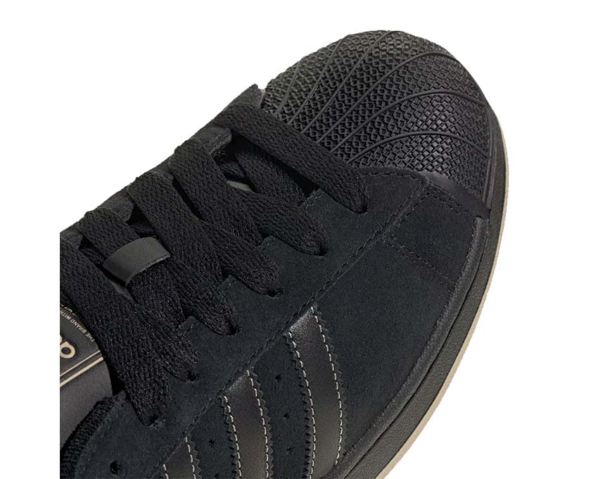 Adidas Superstar II Core Black vista lateral — puntera concha negra icónica