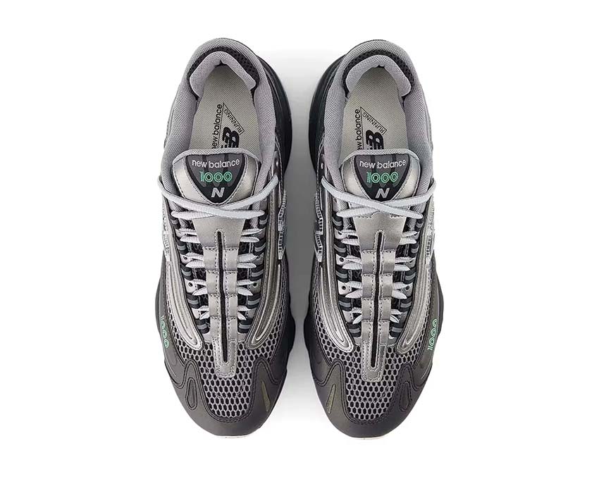 New Balance 1000 Black Silver suela — EVA negro esculpido grip todo terreno