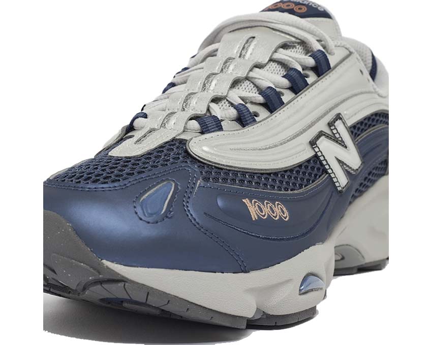 New Balance 1000 Vintage Indigo vista lateral — parte superior de cuero y nobuck tono azul profundo