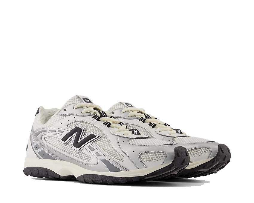 New Balance 204L Silver Metallic vista lateral — perfil plateado iridiscente parte superior lisa