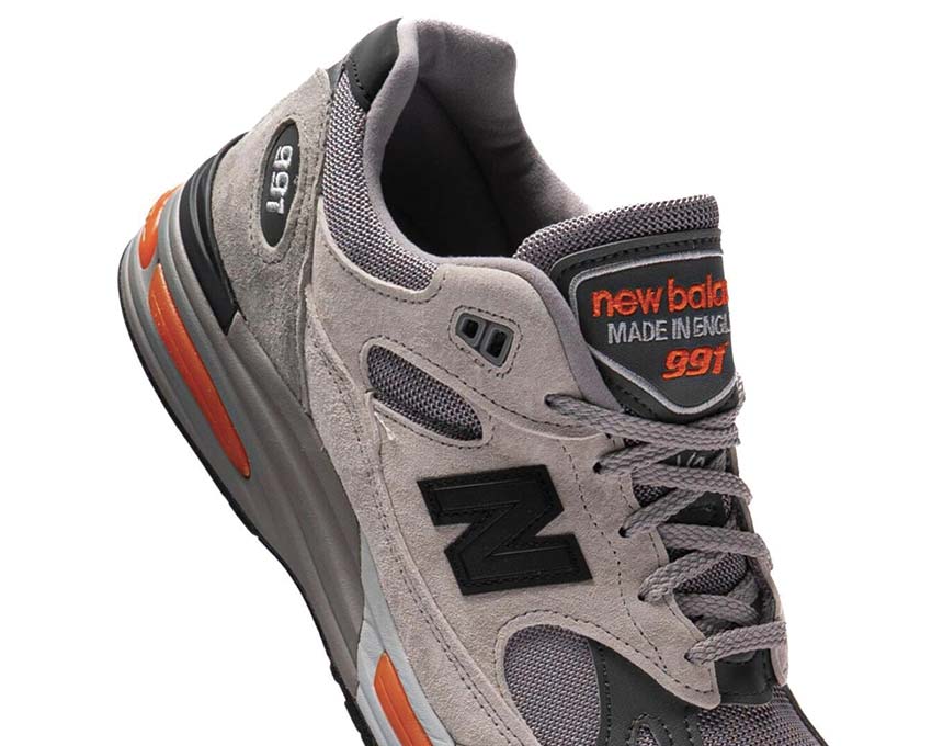 New Balance 991v2 Made in UK Pelican Grey Orange détail — tige daim nylon UK