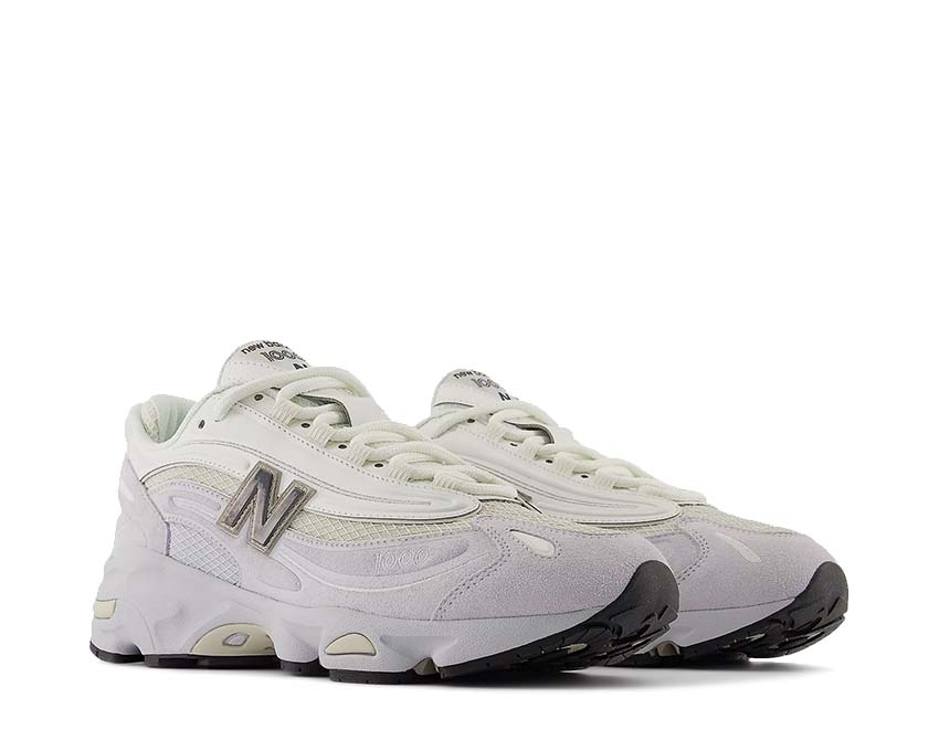 New Balance 1000 Pearl Grey vista lateral — paneles de ante texturado