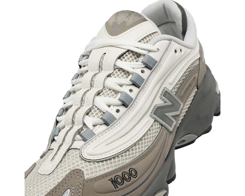 New Balance 1000 Mushroom vista lateral — parte superior cuero y mesh técnico