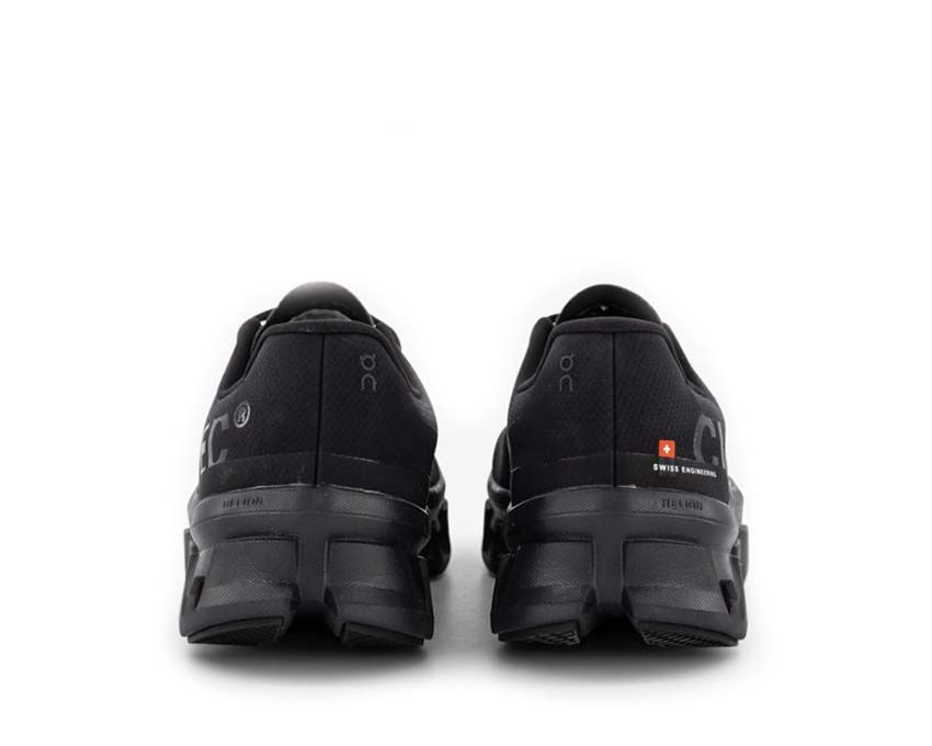 On Cloudmonster All Black vista lateral — amortiguación CloudTec