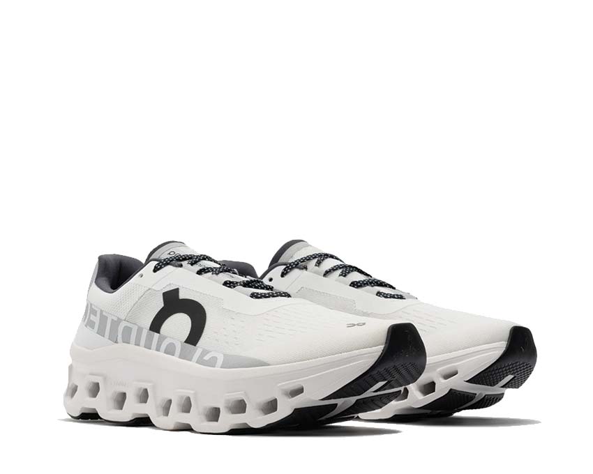 On Cloudmonster Undyed White vista lateral — amortiguación CloudTec